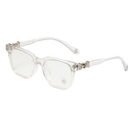 Chrome Hearts Cox Ucker 2273 glasses in clear crystal acetate with silver cross hardware, front angle