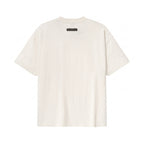 Fear of God Essentials Signature Classic Tee in Light Oatmeal, back view